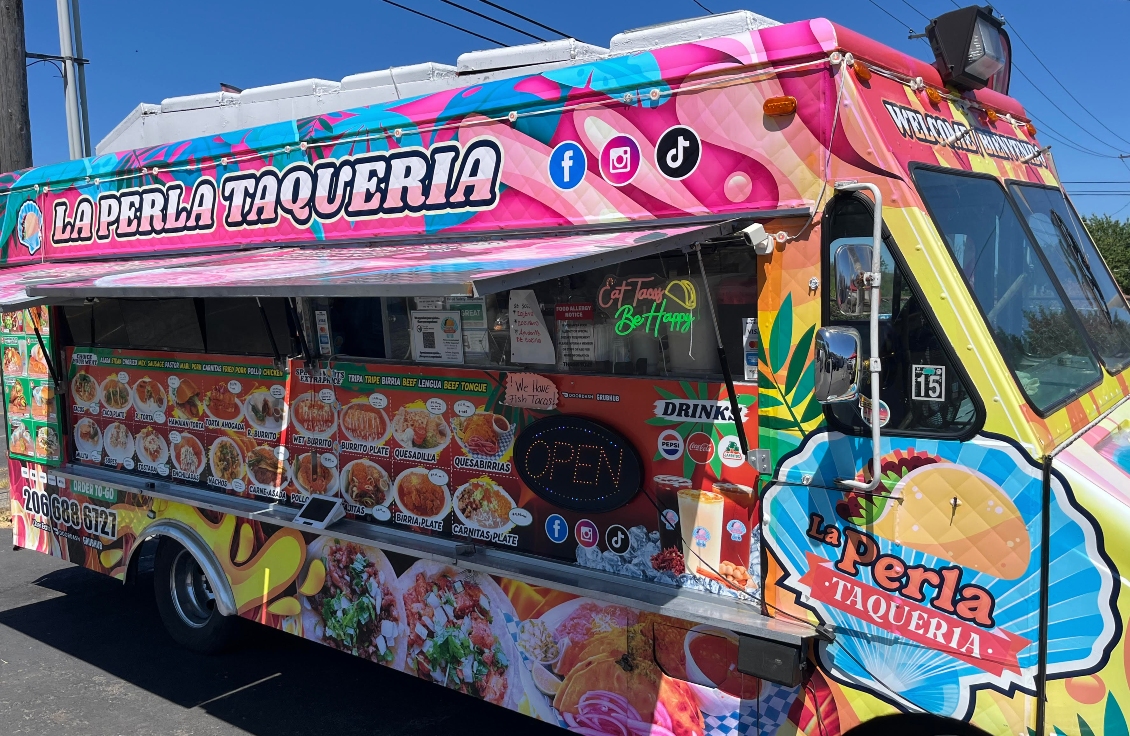 The La Perla Taqueria is a colorful taco truck located in the Hosmer district